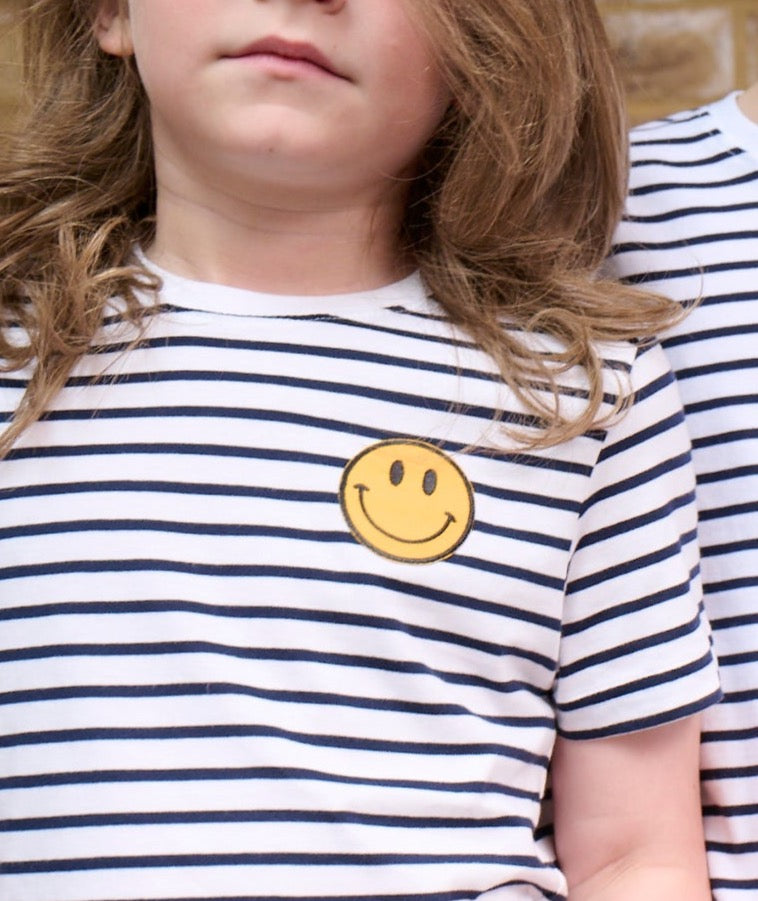 smiley face iron on patch on Breton stripe t-shirt
