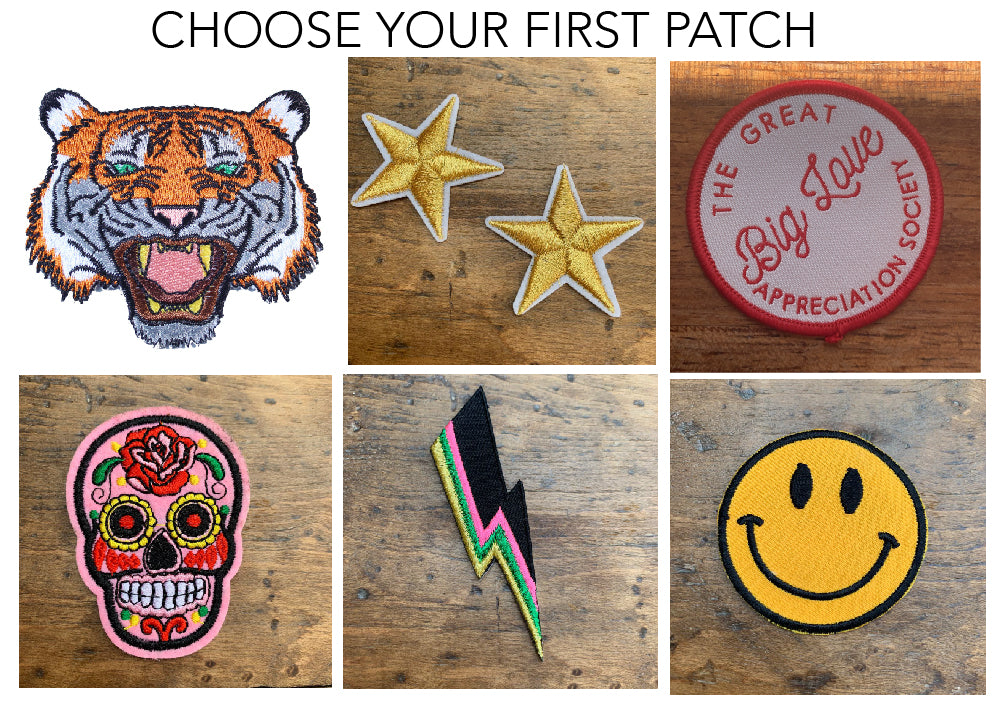6 iron on patches - tiger head, gold stars, red and white patch saying 'the great big love appreciation society' a pink sugar skull, a neon pink and black lightning bolt, and a yellow smiley face